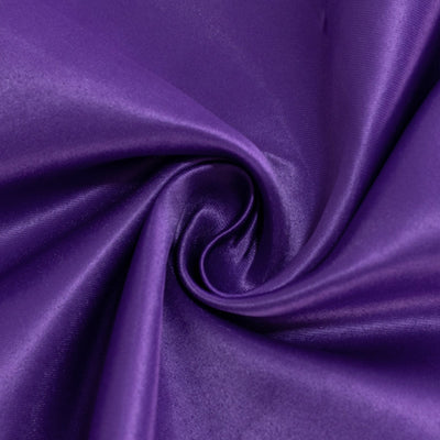 Purple satin fabric with a smooth, shiny texture. #whtbkgd
