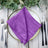 Purple textured napkin elegantly arranged on a plate with cutlery. #whtbkgd