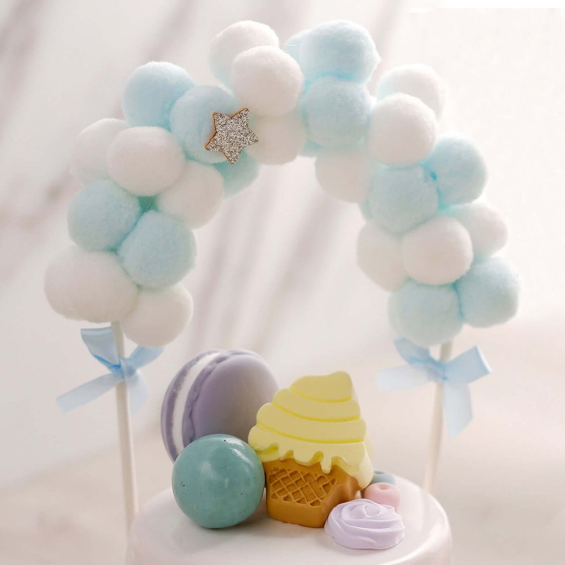 Colorful pastel dessert decorations on a cake.