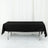 Black tablecloth draped over a rectangular table in a studio setting.
