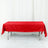 Red tablecloth draped over a folding table in a studio setting.