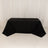Black tablecloth draped over a rectangular table in a studio setting.