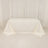 Plain white tablecloth draped over a table in a minimalistic setting.