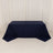 Navy blue tablecloth draped over a table on a plain backdrop.