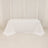 White tablecloth draped over a table in a studio setting.