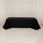 Black tablecloth draped over a table in a studio setting.