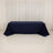 Navy tablecloth draped over a rectangular table on a white backdrop