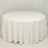 Round white table with a flowing tablecloth on a plain background