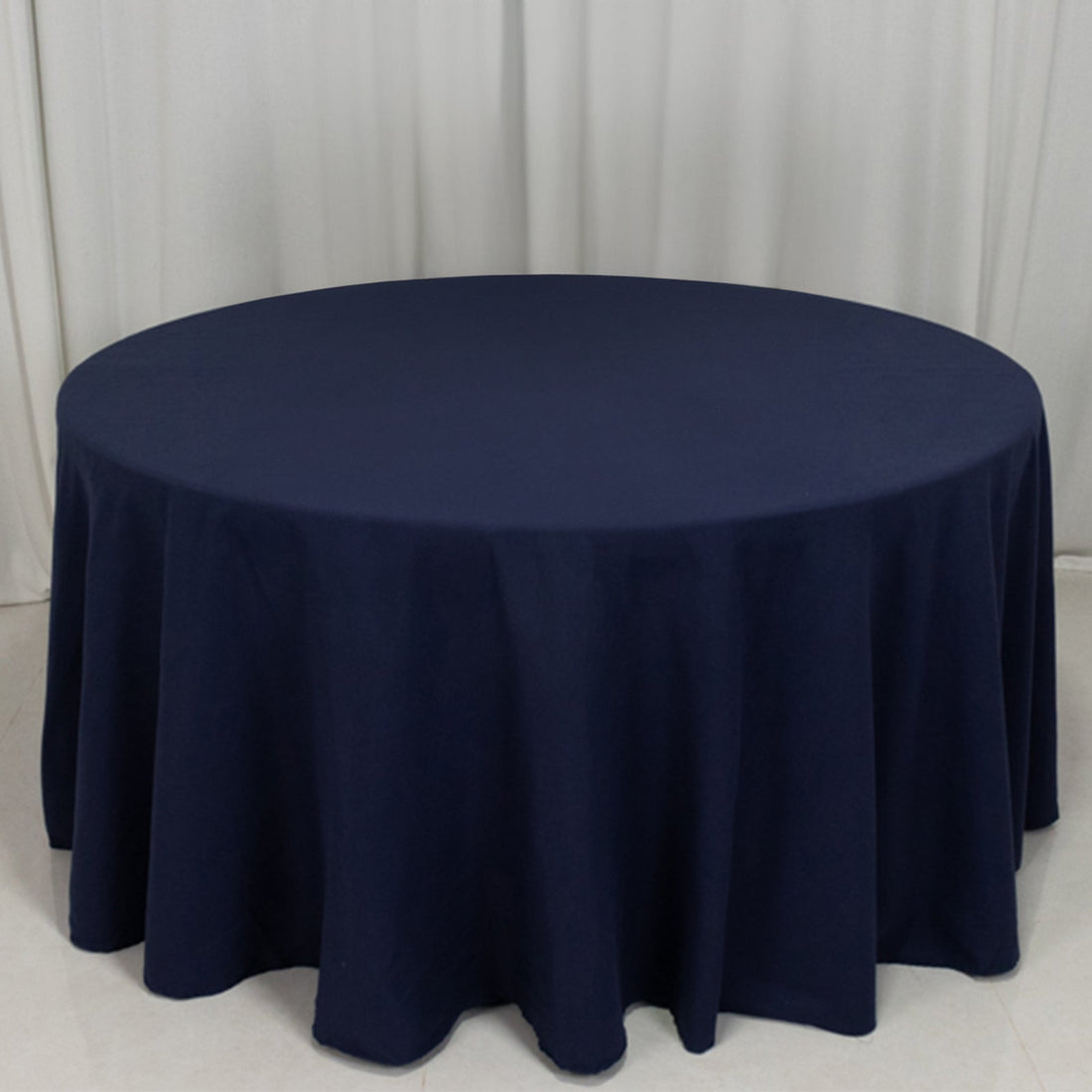Navy round tablecloth with elegant draping