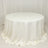 White round table covered with a draped tablecloth.