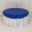 Round blue tablecloth draped over a white table