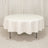 Round white table with a draped tablecloth