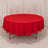 Red round tablecloth draped on a table, showcasing vibrant color and fabric texture.