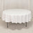 Round white table with a draped tablecloth