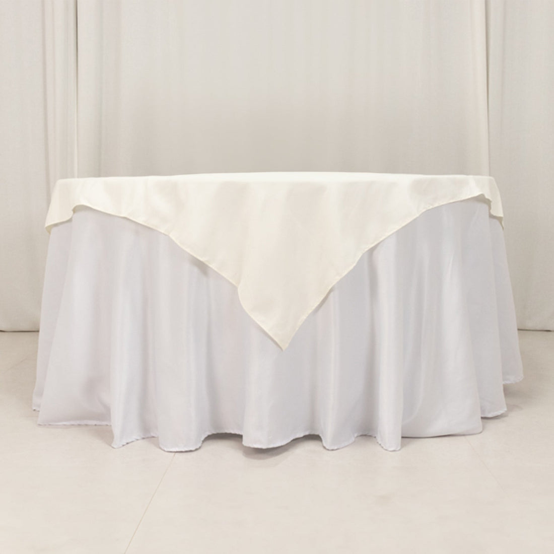 White tablecloth with elegant draping for event decor
