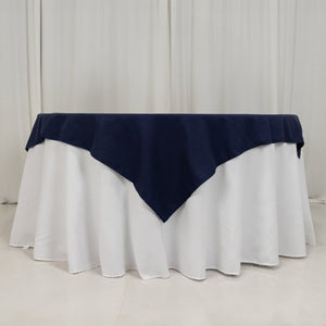 Navy tablecloth draped over a white table for elegant dining settings.