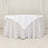 White tablecloth with elegant draping and a triangular corner design.