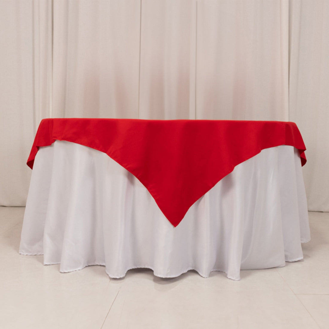 Red and white tablecloth draped elegantly over a table.