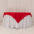 Red and white tablecloth draped elegantly over a table.