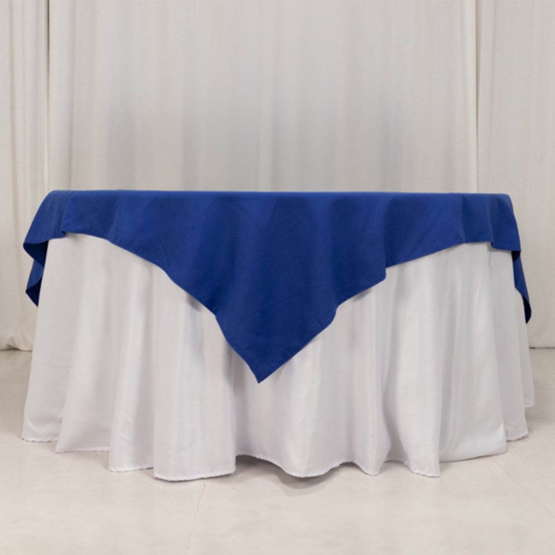 Round table with blue and white tablecloths