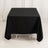 Black tablecloth draped over a table in a studio setting