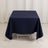 Navy blue tablecloth draped over a square table