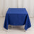 Blue tablecloth draped on a table in a studio setting.