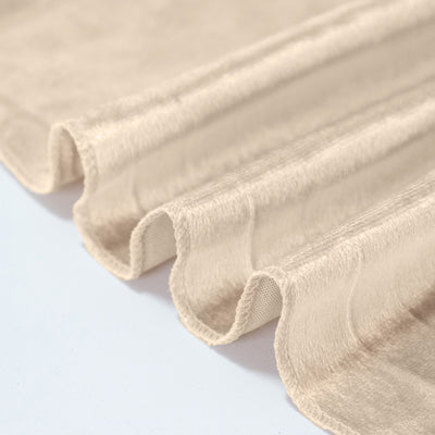 Cream pleated blackout curtain fabric close-up with textured folds