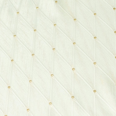 Cream quilted fabric texture with subtle gold dot pattern#whtbkgd