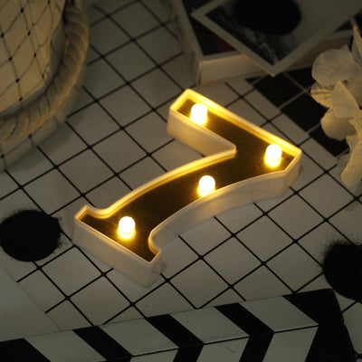 Glowing LED arrow sign on black-and-white tiled floor
