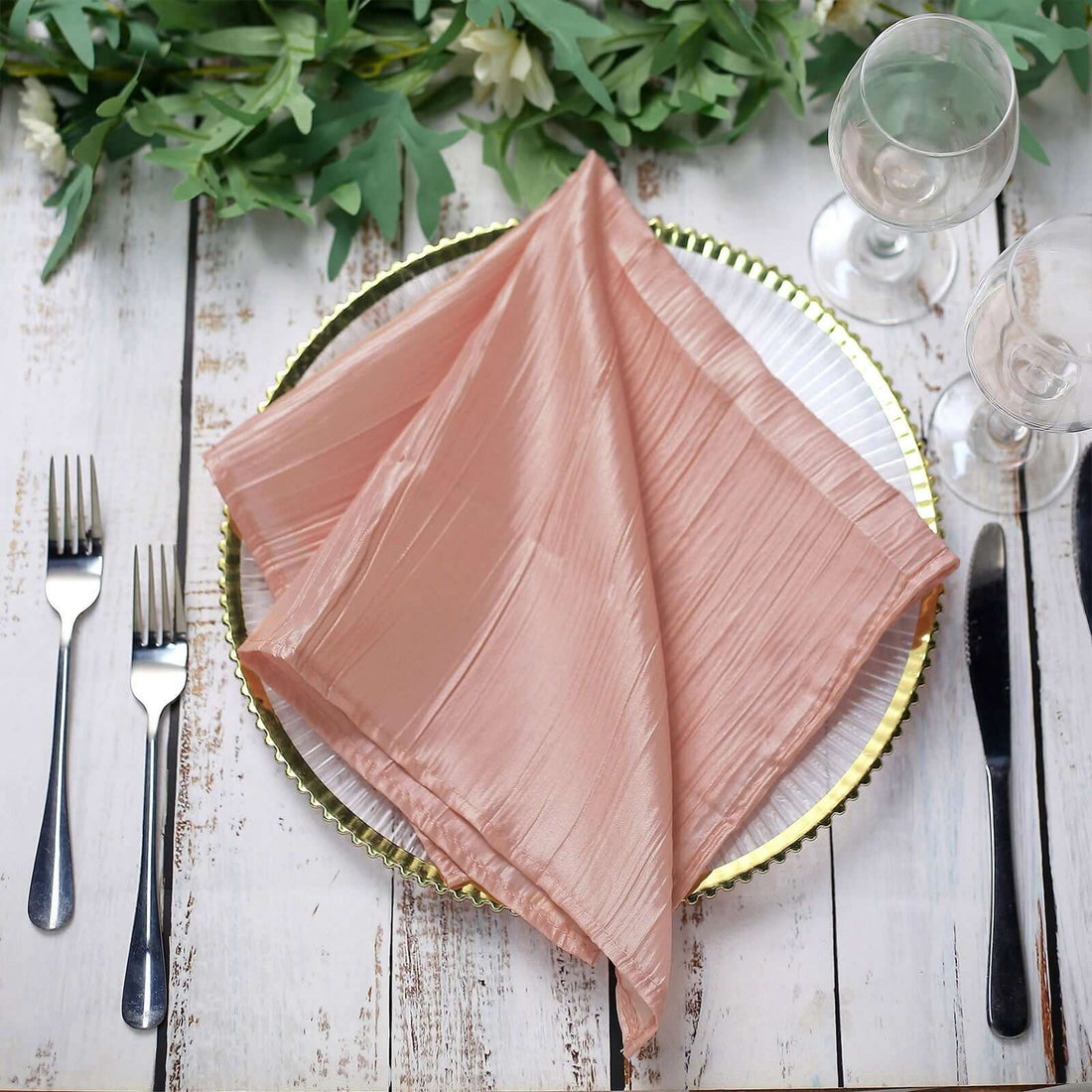 Elegant pink satin napkin elegantly placed on a decorative plate. #whtbkgd