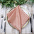 Elegant pink satin napkin elegantly placed on a decorative plate. #whtbkgd