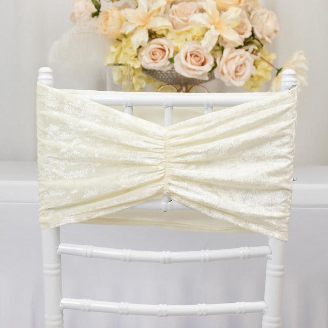 Ivory chair sash with gathered design against a white backdrop