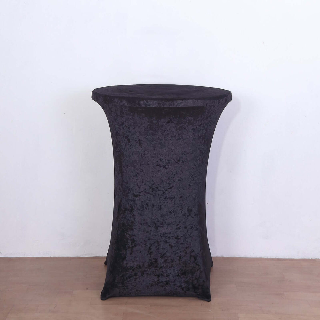 Black stretch table cover for round tables, ideal for events and parties.