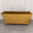 Gold tablecloth draped over a rectangular table in a studio setting.
