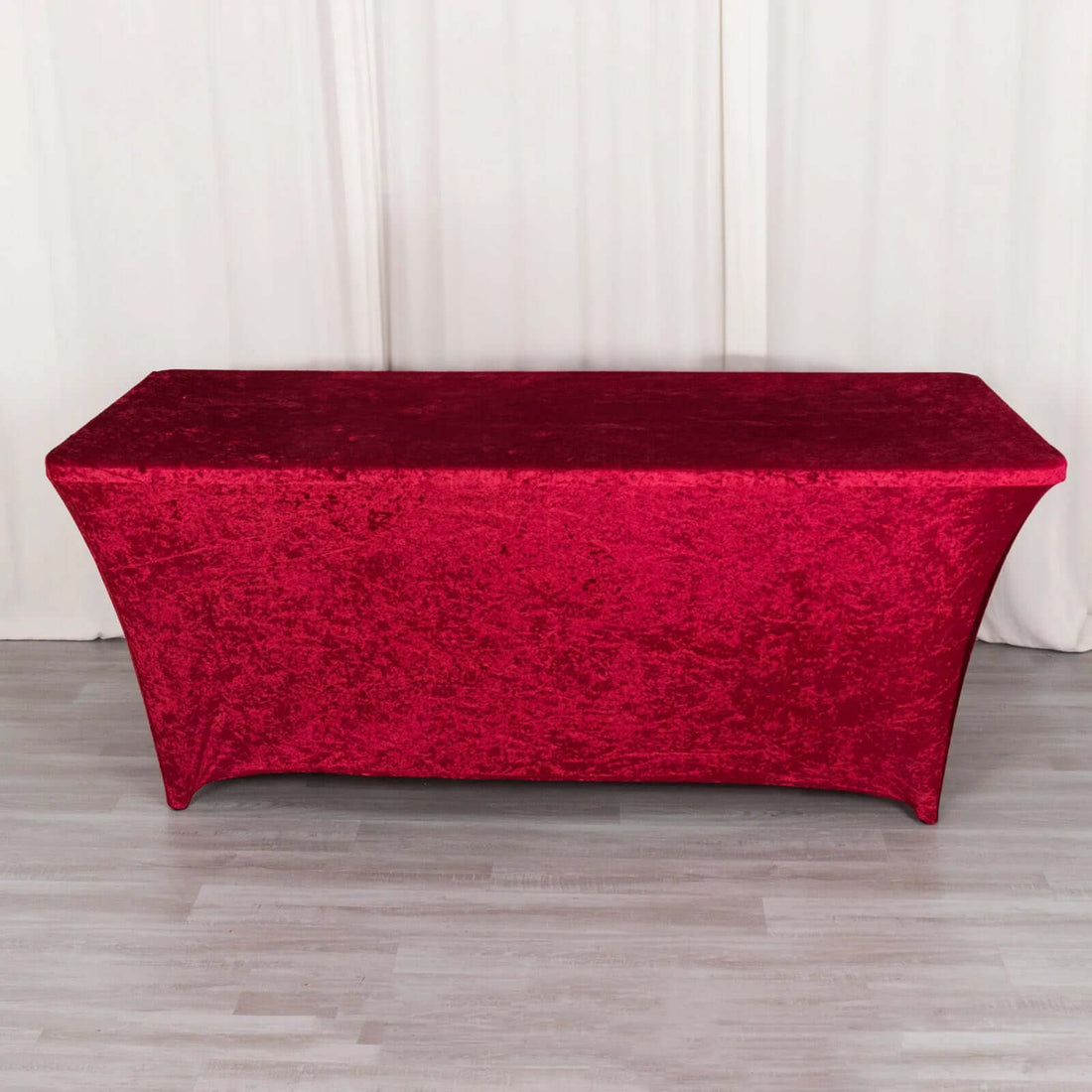 Red stretch table cover for event decor.