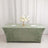 Green velvet tablecloth with floral centerpiece and plates.