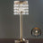 Elegant gold table lamp with crystal beads, showcasing a modern design.