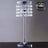 Elegant crystal table lamp with a reflective base and hanging beads.