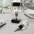 Crystal wine stopper in gift box with ribbon, elegant table setting accessory.