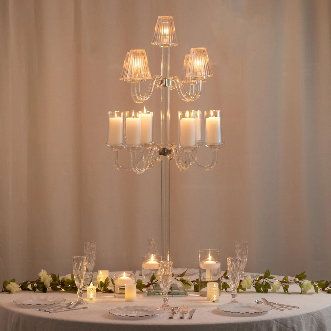 Elegant crystal chandelier centerpiece on a beautifully set dining table.
