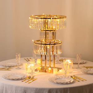 Elegant gold and crystal chandelier with fairy lights on a dining table.