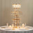Elegant tiered chandelier with crystal accents and fairy lights for dining decor.