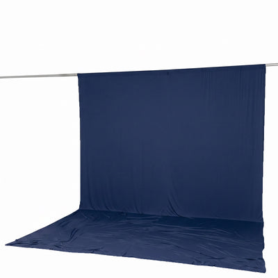 Dark blue photography backdrop with floor on a support rod