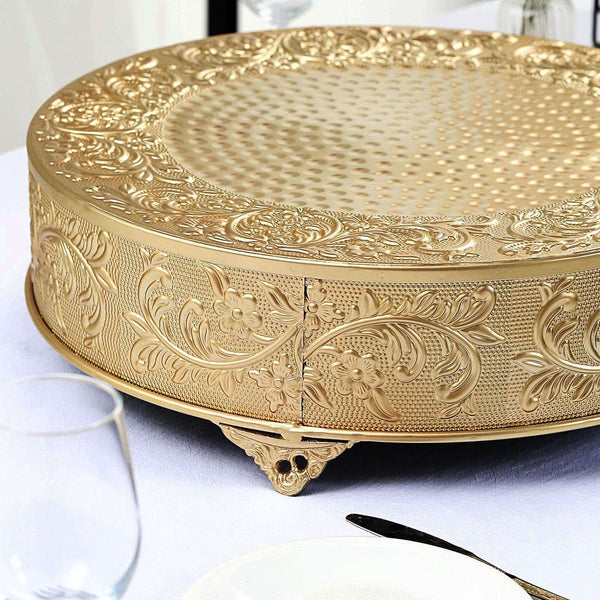 Ornate gold serving platter with intricate floral designs and textured surface.