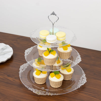 Three-tiered dessert stand with lemon cupcakes and macarons.
