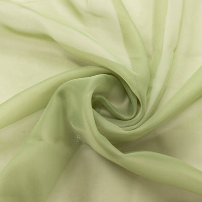 Light green sheer fabric draped in soft folds. #whtbkgd