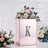 Mirrored floral arrangement box with letter K and pink flowers