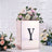 Decorative rose gold box with a floral arrangement and letter "Y" accent.