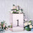 Rose gold decorative box with floral arrangement and the number 1.